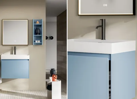 Kompakter Waschtisch mit hellblauer Front, weißem Becken und integrierter Schubladenlösung in moderner Badgestaltung von Stocco.